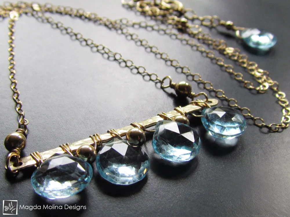The Something Blue Necklace: Horizontal Hammered Gold And Blue Topaz Drops