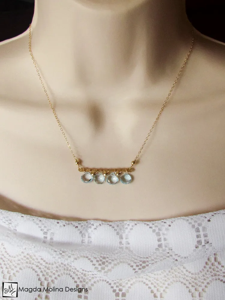 The Something Blue Necklace: Horizontal Hammered Gold And Blue Topaz Drops